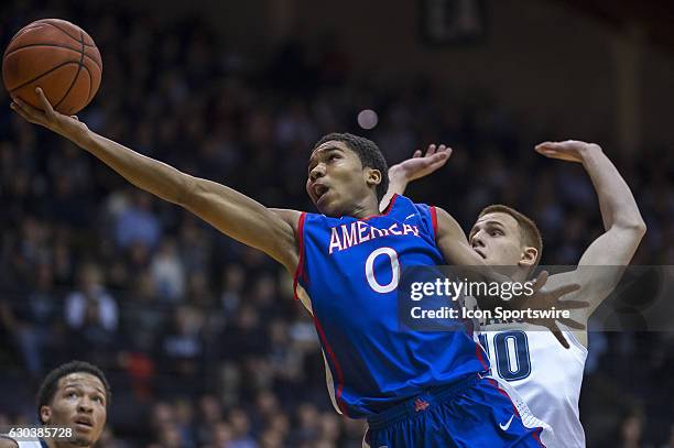 American University Eagles guard Sa'eed Nelson releases his shot with his outstretched hand during the game between the Villanova Wildcats and the...