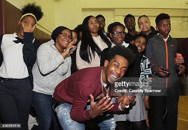 Rapper Desiigner makes a surprise holiday visit to the Boys and Girls Club in the borough of Brooklyn on December 21, 2016 in New York City.