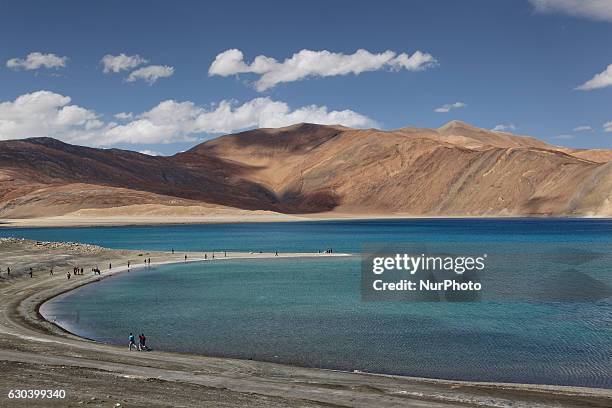Pangong Lake in Ladakh, Jammu and Kashmir, India. Pangong Lake is a salt water lake in the Himalayas situated at a height of about 4,350 m . The lake...