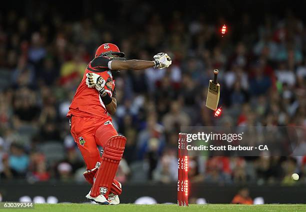 Dwayne Bravo of the Renegades loses grip of his bat as he is bowled out during the Big Bash League match between the Melbourne Renegades and Sydney...