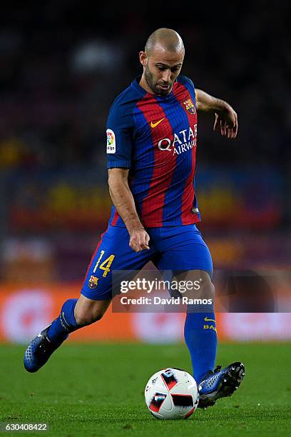 Javier Mascherano of FC Barcelona runs with the ball during the Copa del Rey round of 32 second leg match between FC Barcelona and Hercules at Camp...