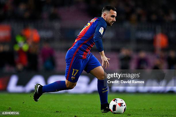 Paco Alcacer of FC Barcelona runs with the ball during the Copa del Rey round of 32 second leg match between FC Barcelona and Hercules at Camp Nou on...