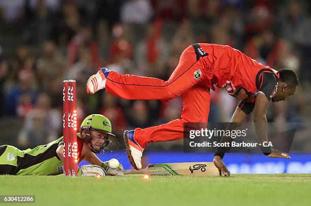Dwayne Bravo of the Renegades runs out Jake Doran of the Thunder during the Big Bash League match between the Melbourne Renegades and Sydney Thunder...