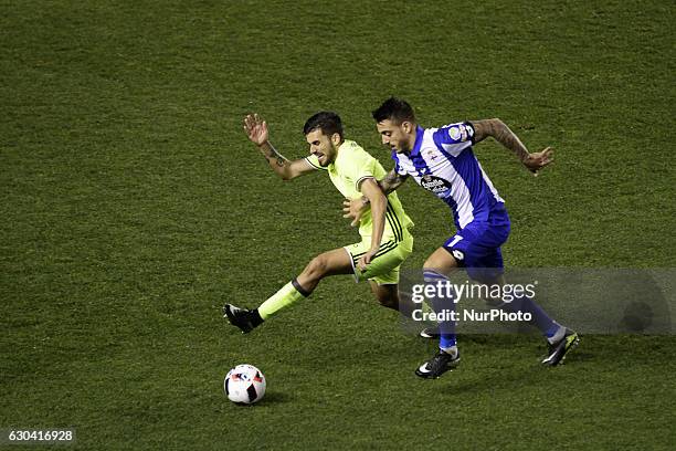 Joselu of Deportivo de La Coruña compete for the ball against Pezzella of Real Betis Balompie during the spanish Copa del Rey match between Real Club...