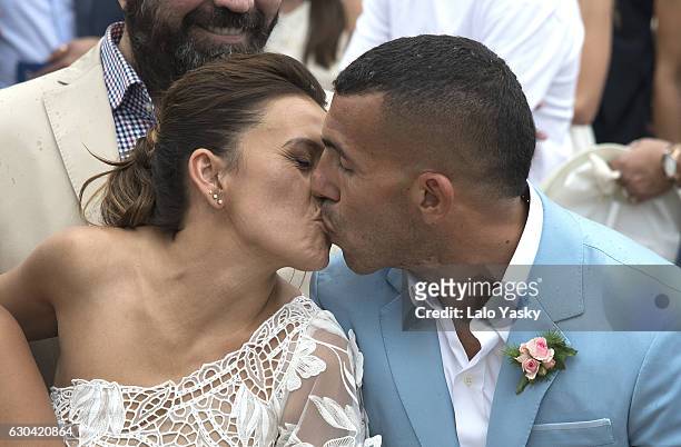 Vanesa Mansilla and Carlos Tevez leave the San Isidro City Hall after their civil wedding ceremony on December 22, 2016 in Buenos Aires, Argentina.
