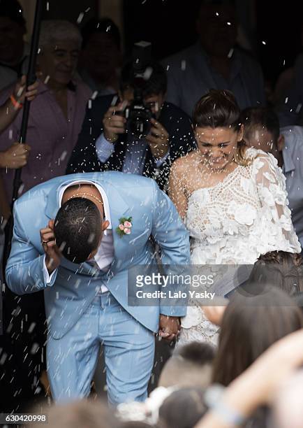 Carlos Tevez and Vanesa Mansilla leave the San Isidro City Hall after their civil wedding ceremony on December 22, 2016 in Buenos Aires, Argentina.