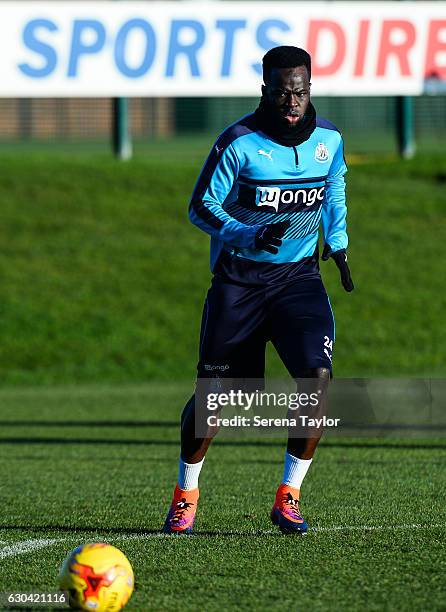 Cheick Tiote looks at the ball after he passes the ball during Newcastle United Training Session at The Newcastle United Training Centre on December...