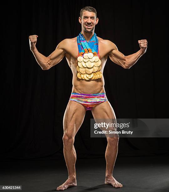 Olympic swimmer Michael Phelps is photographed for Sports Illustrated with his Olympic medals, 28 in all, 23 gold, on August 29, 2016 in New York...