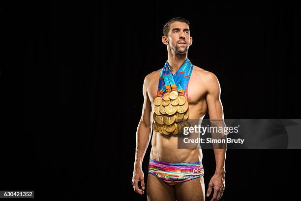 Olympic swimmer Michael Phelps is photographed for Sports Illustrated with his Olympic medals, 28 in all, 23 gold, on August 29, 2016 in New York...