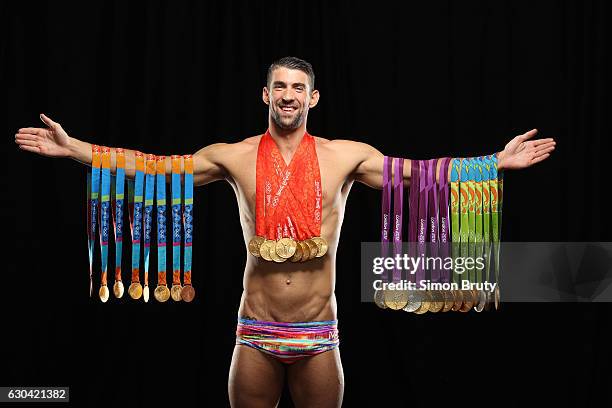 Olympic swimmer Michael Phelps is photographed for Sports Illustrated with his Olympic medals, 28 in all, 23 gold, on August 29, 2016 in New York...