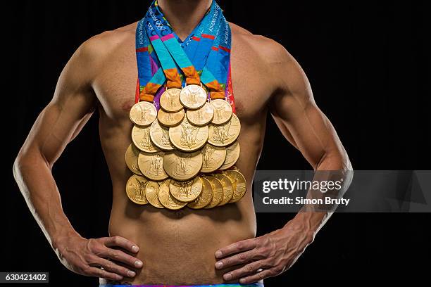 Olympic swimmer Michael Phelps is photographed for Sports Illustrated with his Olympic medals, 28 in all, 23 gold, on August 29, 2016 in New York...