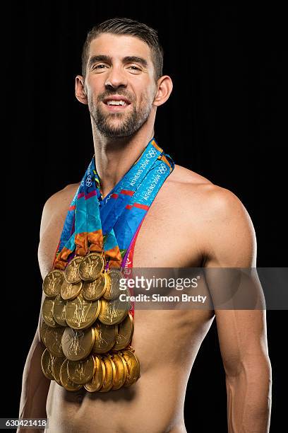 Olympic swimmer Michael Phelps is photographed for Sports Illustrated with his Olympic medals, 28 in all, 23 gold, on August 29, 2016 in New York...