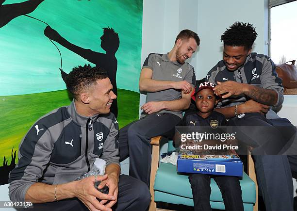 Aaron Ramsey, Kieran Gibbs and Chuba Akpom of Arsenal visit the patients on the childrens ward at Whittington Hospital on December 22, 2016 in...