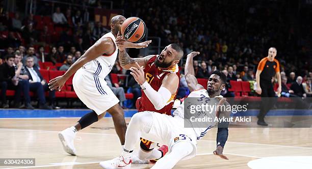 Goksenin Koksal, #61 of Galatasaray Odeabank Istanbul competes with Paul Brandon, #33 of Anadolu Efes Istanbul during the 2016/2017 Turkish Airlines...