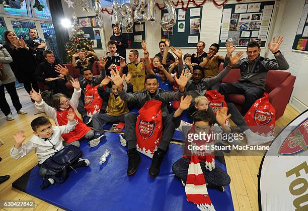 Arsenal's Danny Welbeck, Francis Coquelin, Theo Walcott and Laurent Koscielny during a visit to charity Centre 404 on December 22, 2016 in London,...