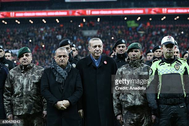 Turkish President Recep Tayyip Erdogan poses for a photo with Turkish police members and head coach of the Turkish National Soccer Team, Fatih Terim...
