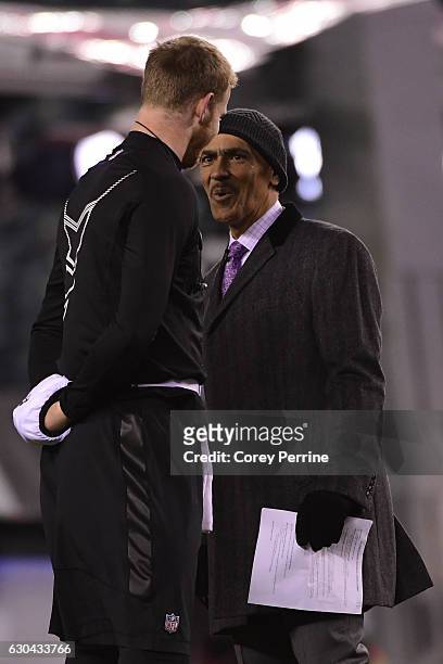Tony Dungy, former Indianapolis Colts head coach and current NFL analyst, talks with Carson Wentz of the Philadelphia Eagles before the game against...