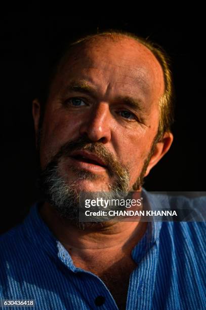 In this photograph taken on December 16 Scottish historian and writer William Dalrymple poses at his farm house in New Delhi. - Many precious stones...
