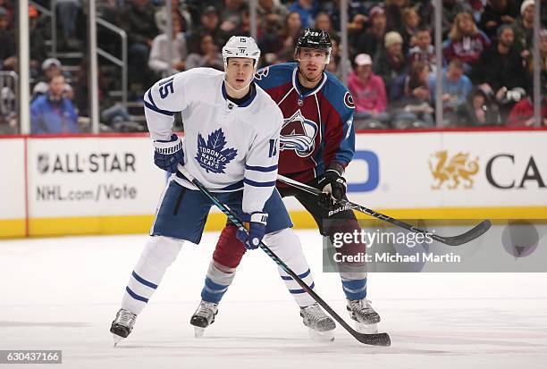 Patrick Wiercioch of the Colorado Avalanche and Matt Martin of the Toronto Maple Leafs watch action down ice at the Pepsi Center on December 22, 2016...