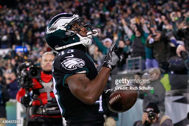 Running back Darren Sproles of the Philadelphia Eagles celebrates after scoring a touchdown against the New York Giants during the first quarter of...