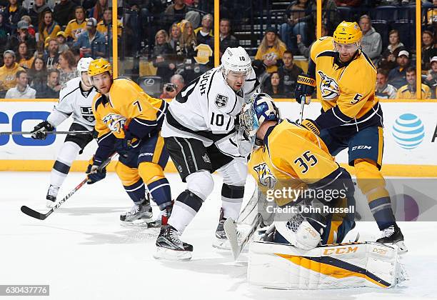 Pekka Rinne of the Nashville Predators blocks a shot against Devin Setoguchi of the Los Angeles Kings as Predators Adam Pardy defends during an NHL...