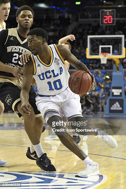 Guard Isaac Hamilton drives to the basket during an NCAA basketball game between the Western Michigan Broncos and the UCLA Bruins on December 21 at...