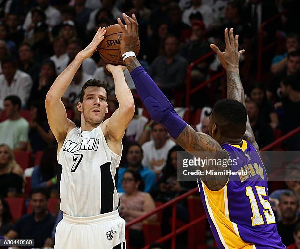 Miami Heat guard Goran Dragic shoots against Lakers' Thomas Robinson in the first quarter of the Miami Heat vs Los Angeles Lakers Thursday, Dec. 22,...