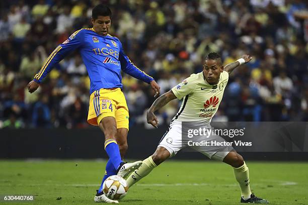 Hugo Ayala of Tigres struggles for the ball with Michael Arroyo of America during the Final first leg match between America and Tigres UANL as part...