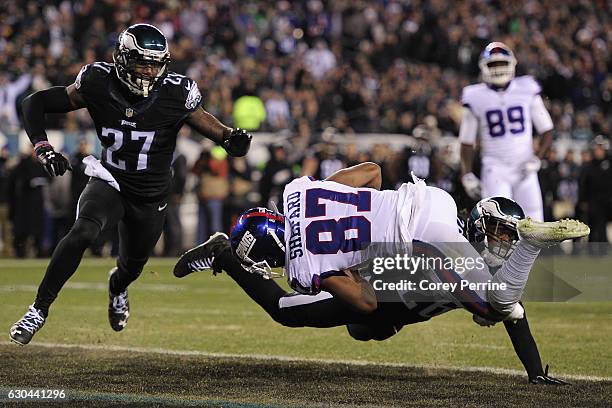 Sterling Shepard of the New York Giants scores a touchdown against Jaylen Watkins as Malcolm Jenkins, both of the Philadelphia Eagles, looks on, in...