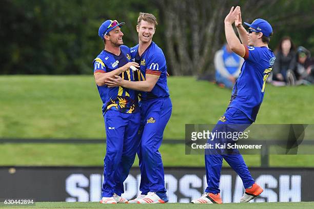 Hamish Rutherford of the Volts is congratulated by teammates after dismissing Tom Latham of the Kings during the McDonalds Super Smash T20 match...