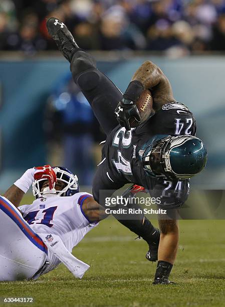 Running back Ryan Mathews of the Philadelphia Eagles is tackled by corner back Dominique Rodgers-Cromartie of the New York Giants in the fourth...