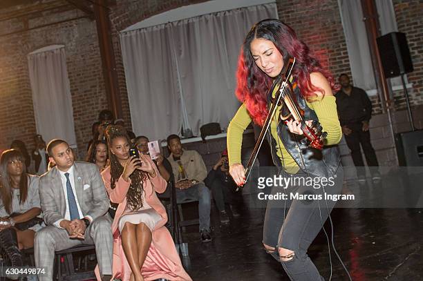 Violinist Angelina Sherie performs during the 9th Annual Celebration 4 A Cause Fashion Show at King Plow Arts Center on December 22, 2016 in Atlanta,...