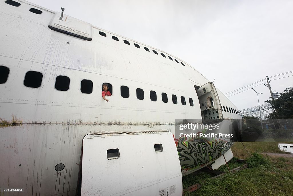 A child seen playing in the front section of the Boeing 747...