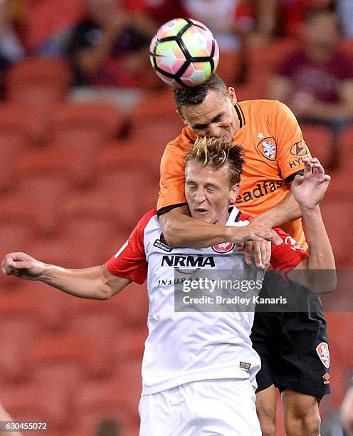 Jade North of the Roar and Lachlan Scott of the Wanderers challenge for the ball during the round 22 A-League match between Brisbane Roar and Western...