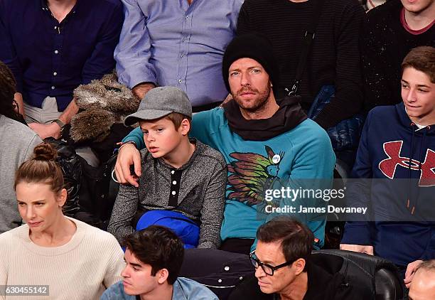 Chris Martin and son Moses Martin attend Golden State Warriors Vs. Brooklyn Nets game at Barclays Center on December 22, 2016 in New York City.