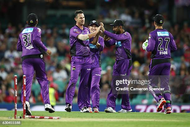 Shaun Tait of the Hurricanes celebrates dismissing Sam Billings of the Sixers during the Big Bash League match between the Sydney Sixers and Hobart...