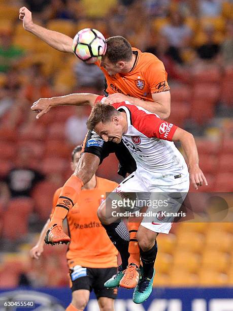 Luke DeVere of the Roar and Brendan Santalab of the Wanderers challenge for the ball during the round 22 A-League match between Brisbane Roar and...