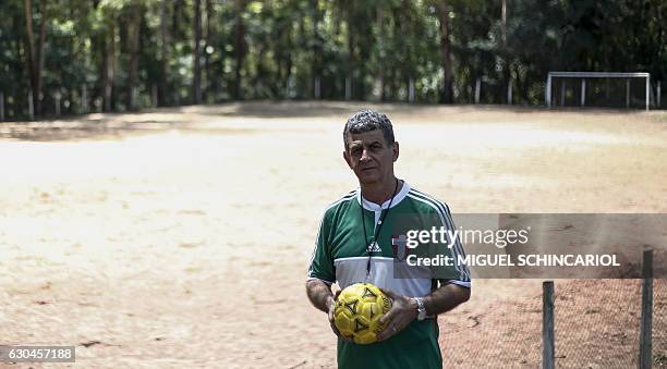 Brazilian coach Mamede poses for a photo in the Clube Pequeninos do Meio Ambiente, where the now Manchester City football player Gabriel Jesus...