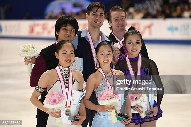 Miu Suzaki and Ryuichi Kihara of Japan , Sumire Suto and Francis Boudereau-Audet of Canada and Marin Ono and Wesley Killing of Canada pose with their...