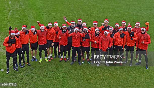 Liverpool manager Jurgen Klopp poses with the Liverpool players in Santa hats during a training session at Melwood Training Ground on December 23,...
