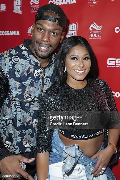 Cortez and Althea Heart attends the Haute Holiday 2nd Annual Shoe And Toy Drive at CossaMia on December 22, 2016 in Hollywood, California.