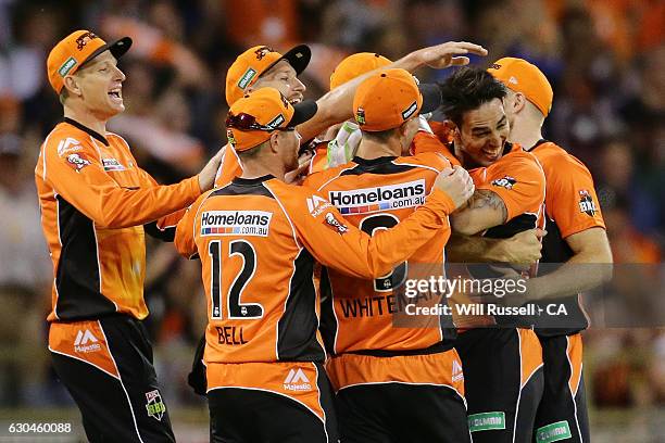 Mitchell Johnson of the Scorchers celebrates after taking his first wicket during the Big Bash League between the Perth Scorchers and Adelaide...