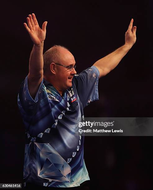 Ian White of Great Britain celebrates his win against Jonny Clayton of Great Britain during day nine of the 2017 William Hill PDC World Darts...