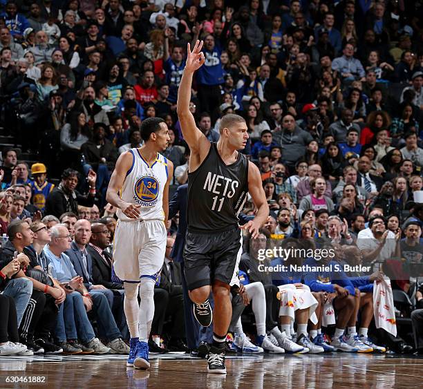 Brook Lopez of the Brooklyn Nets celebrates a three point basket against the Golden State Warriors on December 22, 2016 at Barclays Center in...