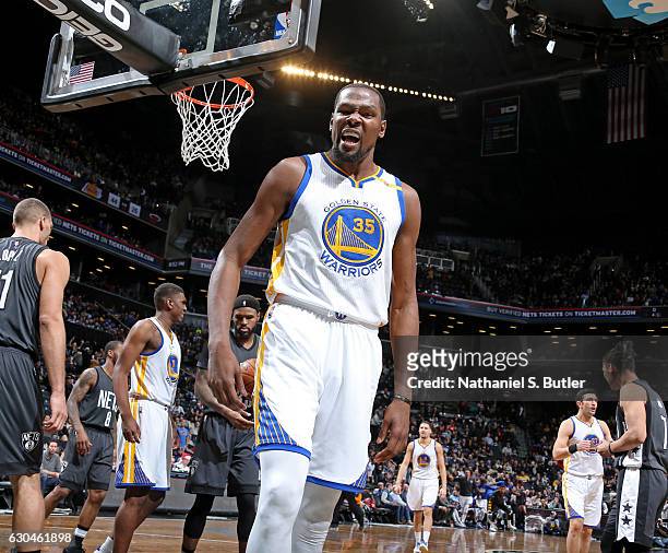 Kevin Durant of the Golden State Warriors celebrates a dunk during the game against the Brooklyn Nets on December 22, 2016 at Barclays Center in...