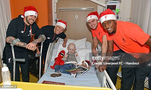 Lucas, Connor Randall, Danny Ings and Divock Origi of Liverpool at Alder Hey Children's Hospital on December 23, 2016 in Liverpool, England.