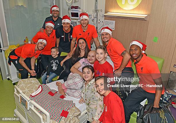 Jurgen Klopp, Jordan Henderson, Alex Manninger, Shamal George, Daniel Sturridge, Dejan Lovren and Ragnar Klavan of Liverpool at Alder Hey Children's...