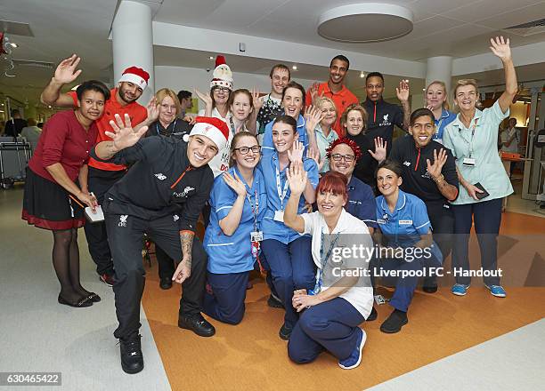 Liverpool players Kevin Stewart, Philippe Coutinho, Joel Matip, Nathaniel Clyne and Roberto Firmino with hopsital staff on the club's annual Alder...