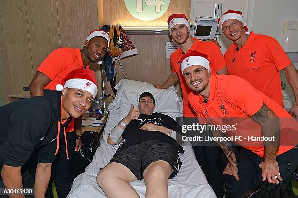 Alex Manninger, Shamal George Daniel Sturridge, Dejan Lovren and Ragnar Klavan of Liverpool at Alder Hey Children's Hospital on December 23, 2016 in...