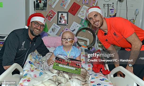 Jurgen Klopp Manager and Jordan Henderson Captain of Liverpool at Alder Hey Children's Hospital on December 23, 2016 in Liverpool, England.